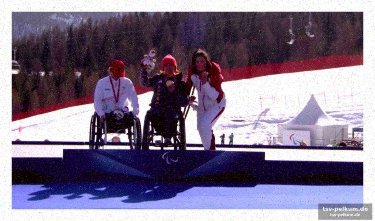 Die fahnenträgerin trägt das ganze team