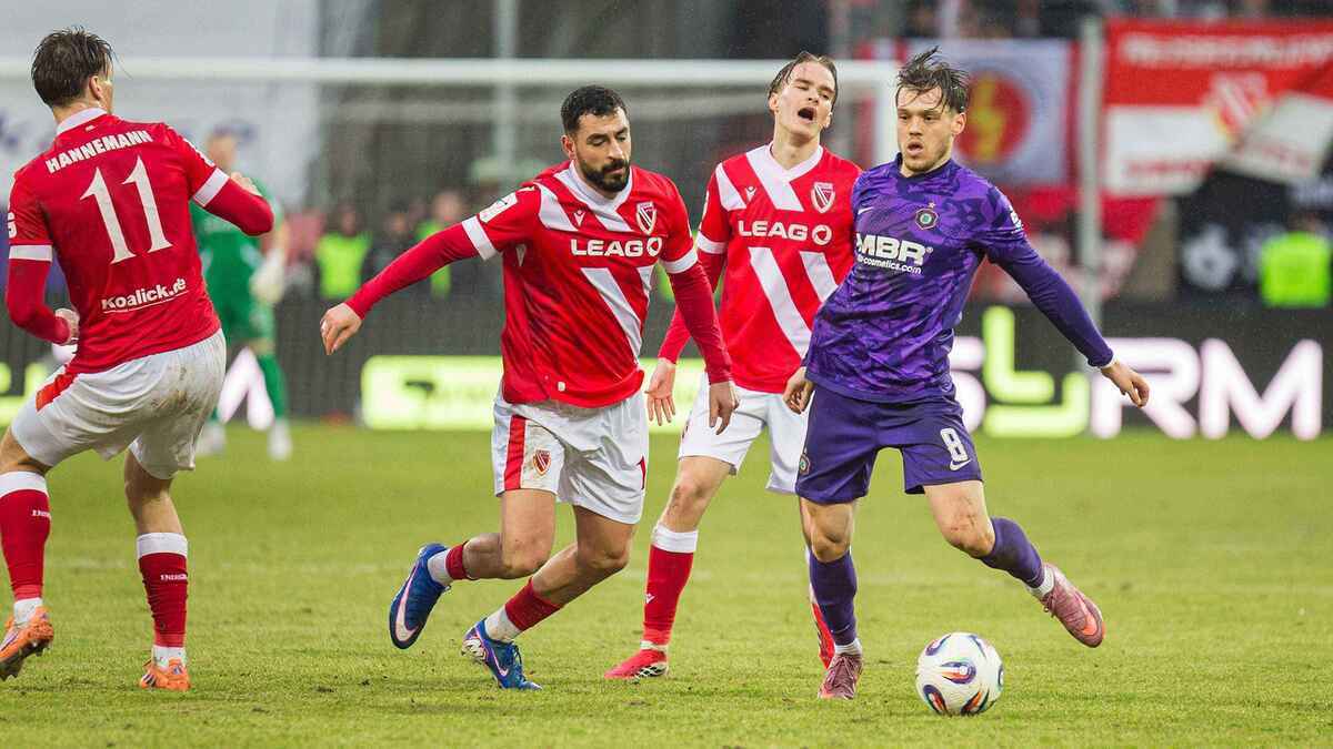 Energiesieg in aue: cottbus verteidigt führung trotz spielunterbrechung