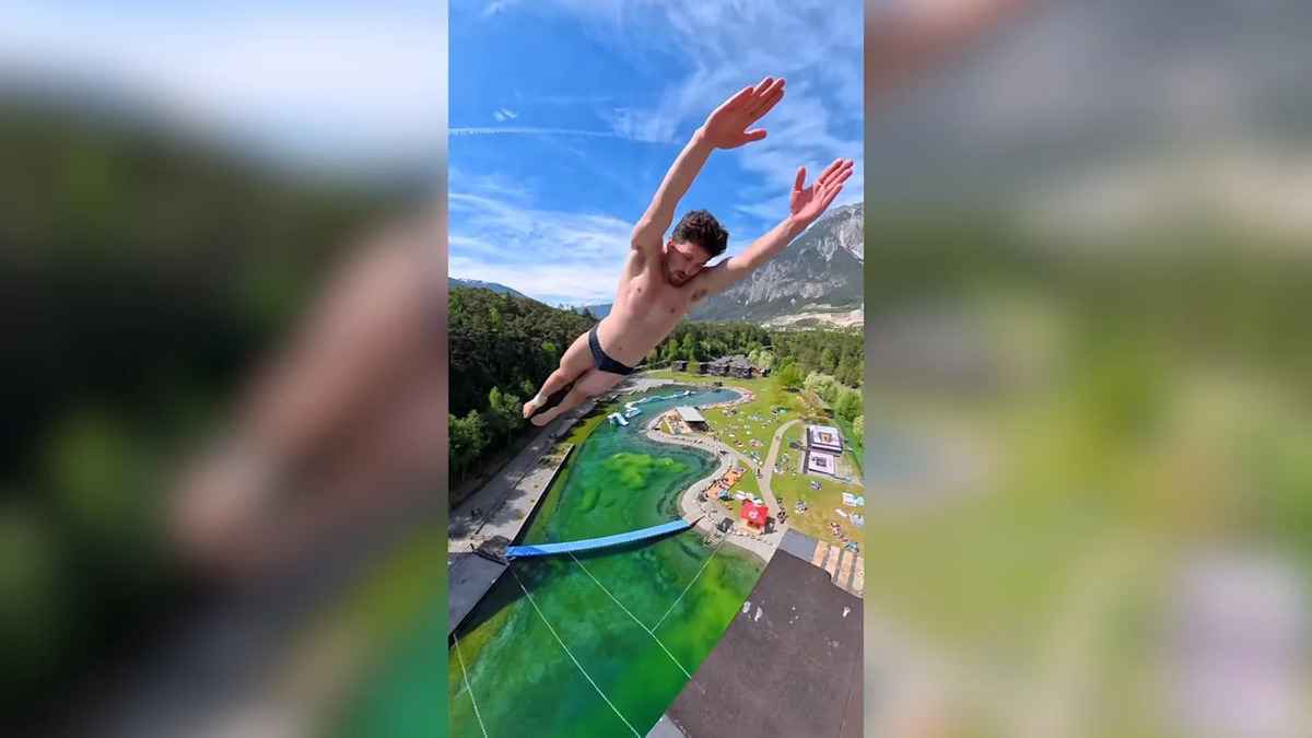 Schock im schwimmbad: turmspringer landet auf riesigem wels!