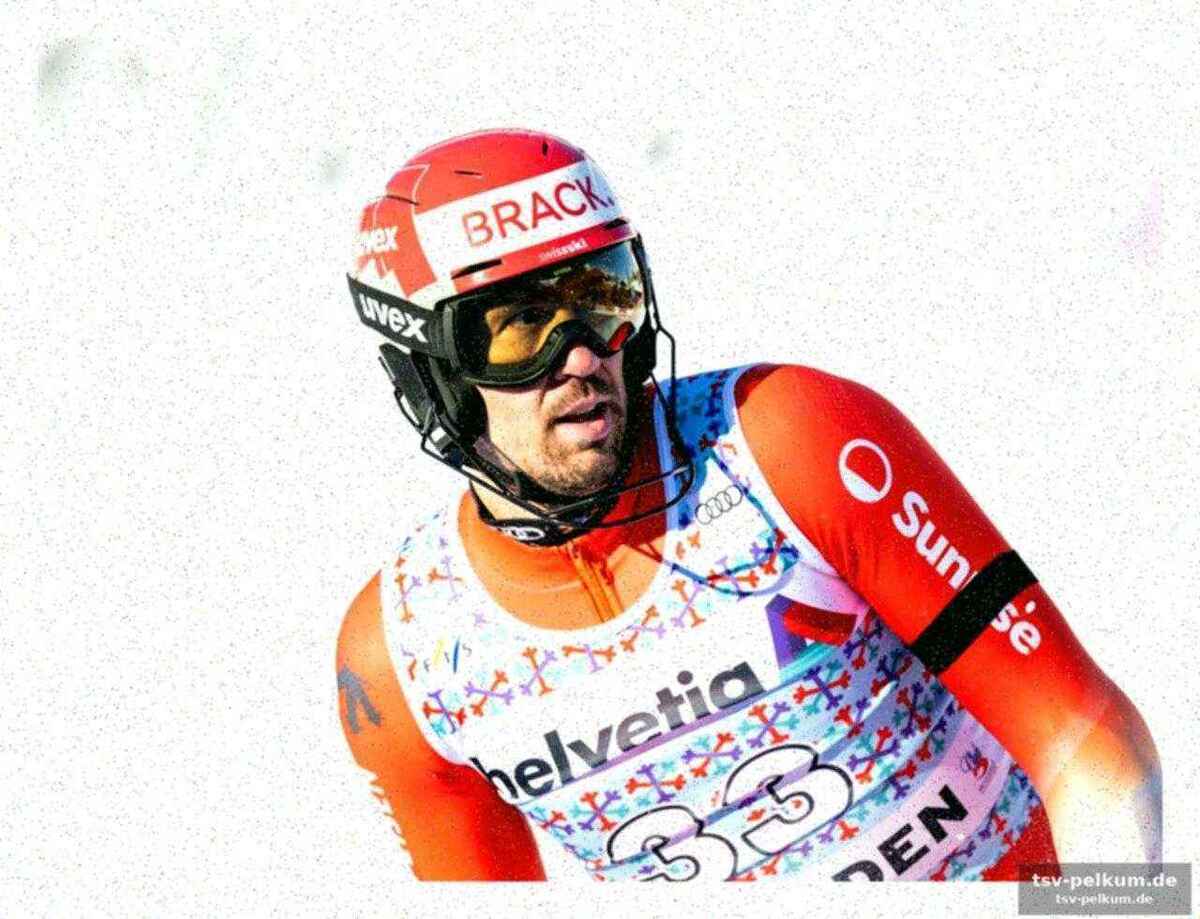 Slalom-chef joris hält die stange für den olympiasieger offen